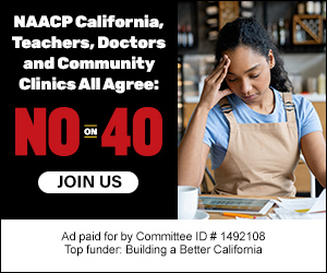 Black woman with dark curly hair sitting at a table, looking stressed and holding her head, with a campaign advertisement in the background stating 'NO ON 40' and supporting organizations.